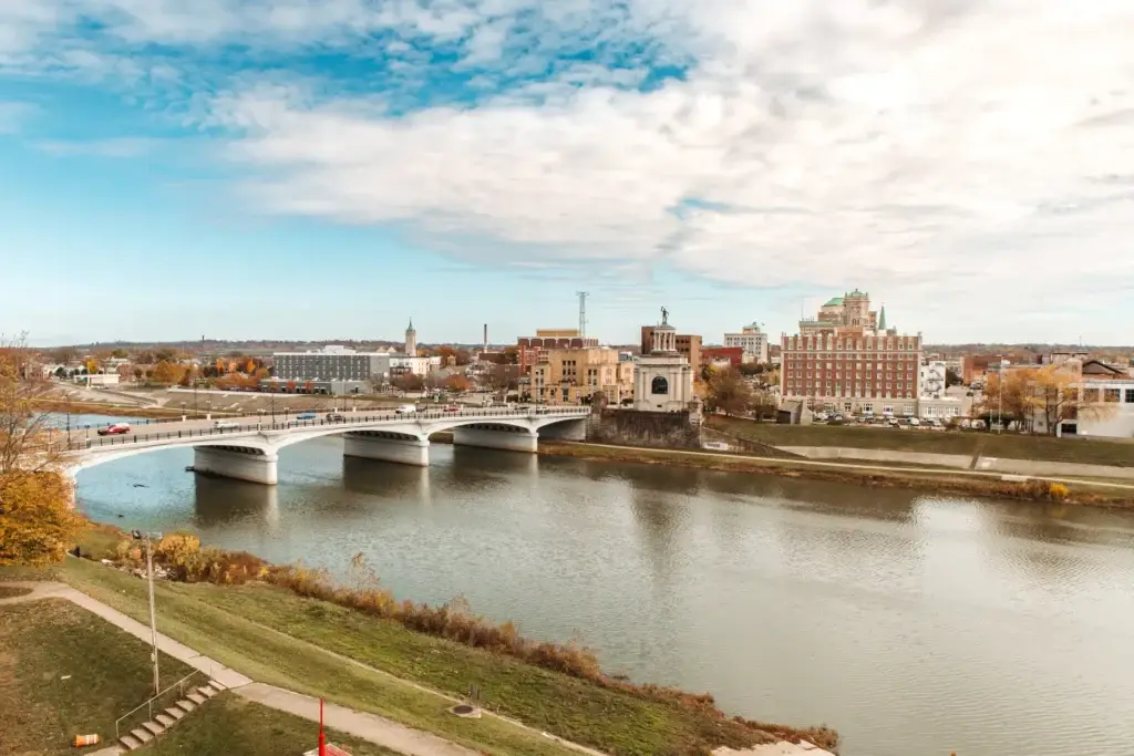 City skyline and bridge over the river in autumn.